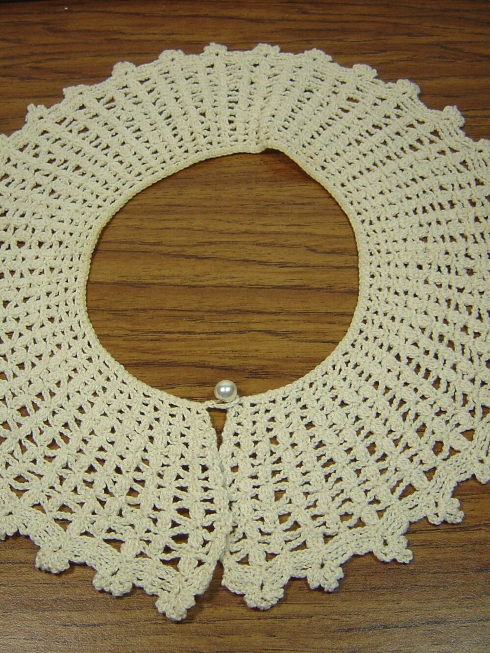 Ladies' off white hand crocheted collar with pearl button closure